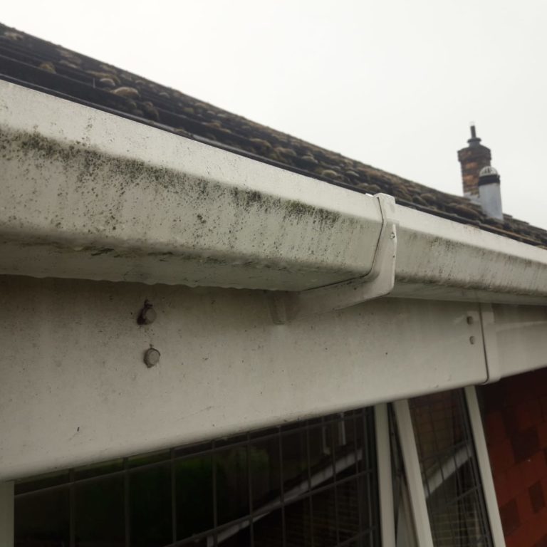 Fascia cleaning. Dirty looking white upvc fascias and soffits that need cleaning.